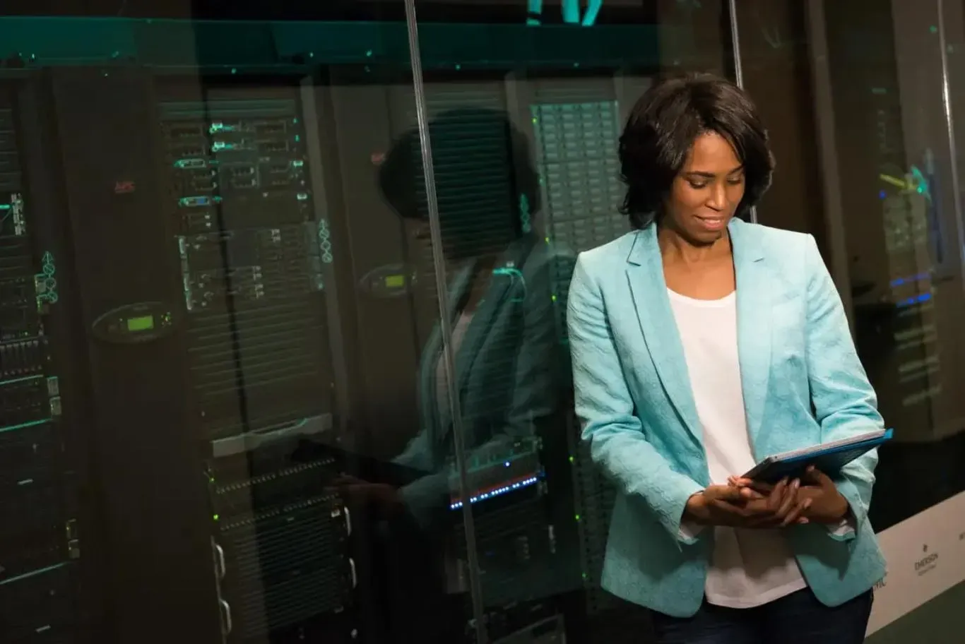 An IT engineer reviewing systems in a data center